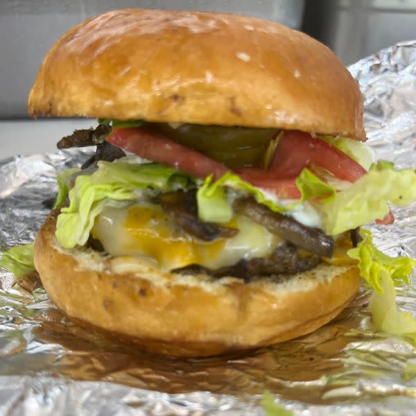 Western burger with lettuce tomato pickle and cheese 
