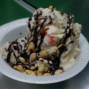 Hand scooped ice cream dessert with toppings