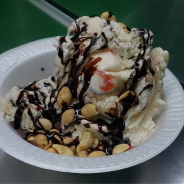 Hand scooped ice cream dessert with toppings