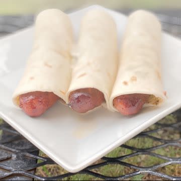 Sausage wrap with chips and drink 