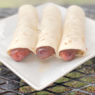 Sausage wrap with chips and drink 