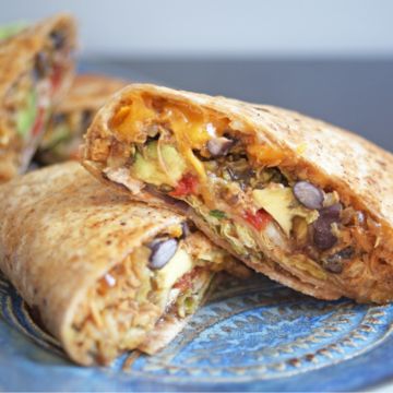 Mojito Burrito - Choice of Grilled Chicken, Pulled Pork or Fried Chicken, Stuffed with Saffron Rice and Beans, Caramelized Onions and Peppers, Sriracha Aioli and Cheddar Jack Cheese