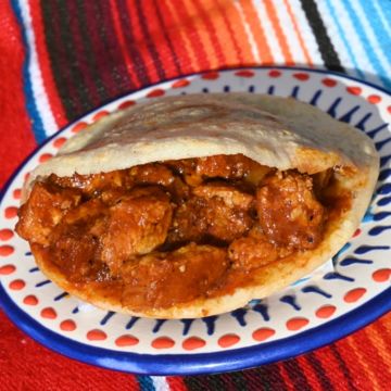 Gordita pork belly in red salsa