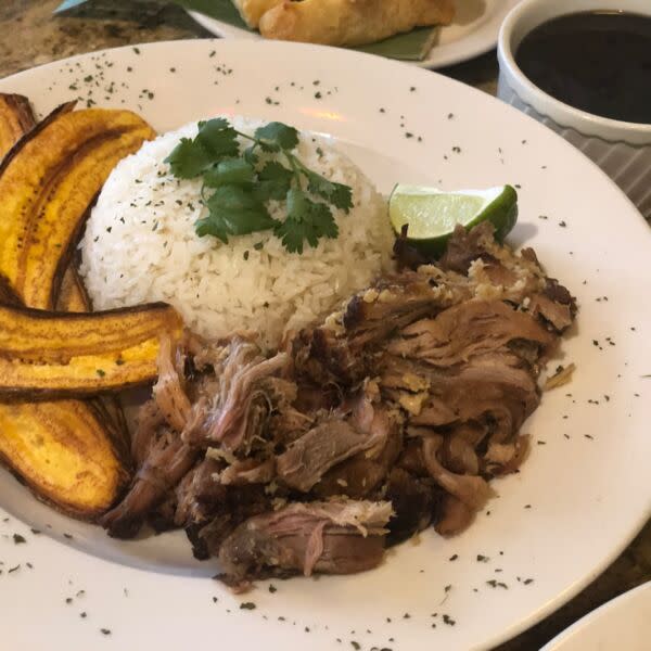 Roast pork meal with rice & plantains