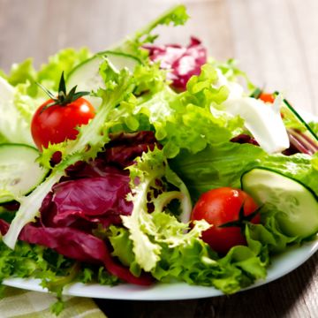 Garden salad dressed with Italian EVO oil
